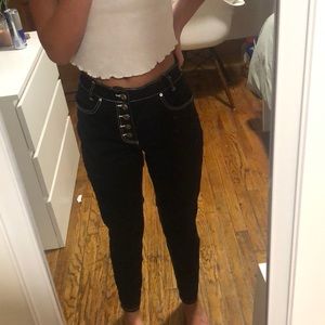 black jeans with white stitching